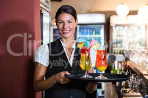 Waitress holding cocktails