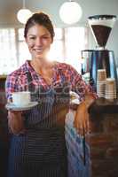 Waitress holding a cup of coffee