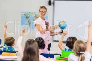 Teacher having lesson with a globe