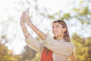Woman taking selfie with the mobile phone