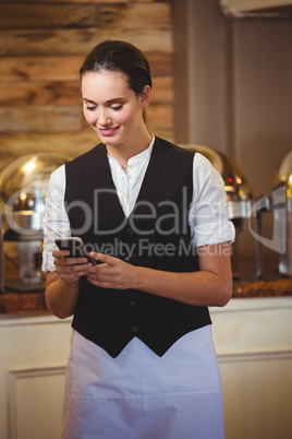 Waitress using a smartphone