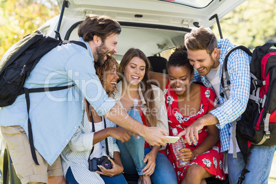 Group of friends looking at mobile phone