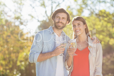 Couple holding glass of wine