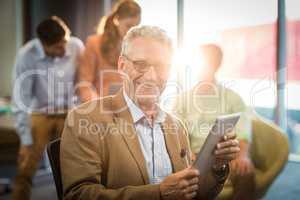 Businessman holding digital tablet