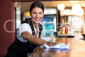 Waitress cleaning the counter