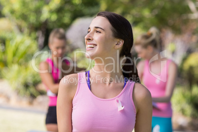 Female volunteer smiling in park