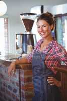 Waitress leaning against counter