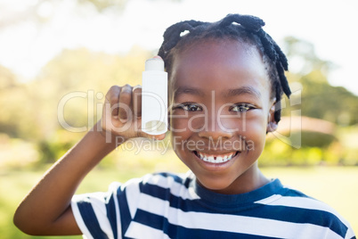 Child posing with an object