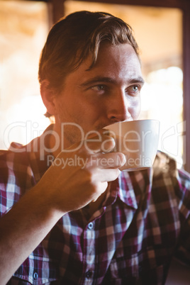 Man drinking a cup of coffee