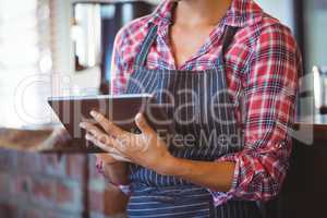 Waitress writing in a book