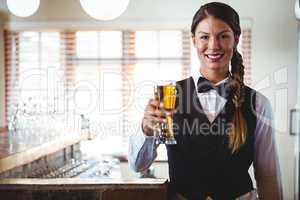 Waitress holding a beer