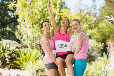 Young athlete women cheering after victory