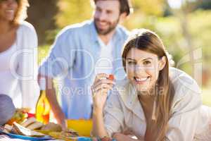 Woman in park having breakfast