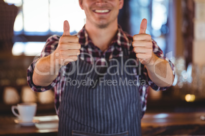 Smiling waiter with thumbs up Smiling waiter with thumbs up