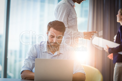 Man using laptop at his desk