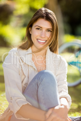 Beautiful woman sitting in park