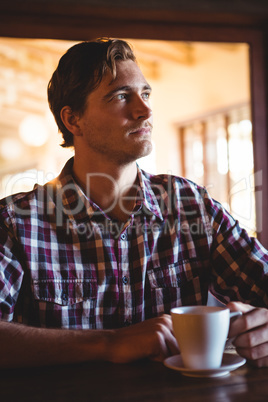 Sad man drinking a coffee