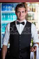 Bartender with napkin draped on his hand