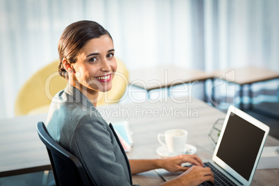 Businesswoman working on laptop