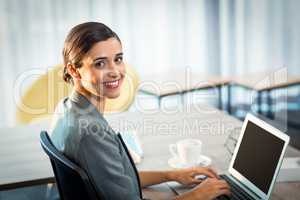 Businesswoman working on laptop