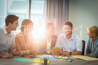 Group of business people discussing at desk