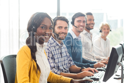 Team of colleagues working at their desk with headset