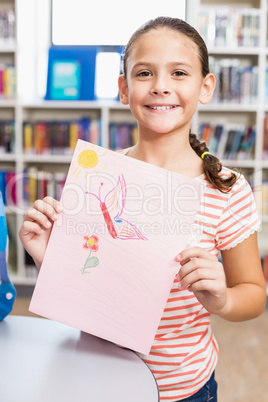 Portrait of schoolgirl showing her drawing