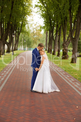 Newlyweds at the wedding photo shoot in the country