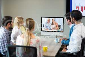 Business people looking at a screen during a video conference