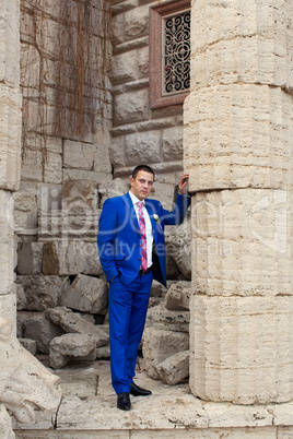 The groom in an expensive gray suit