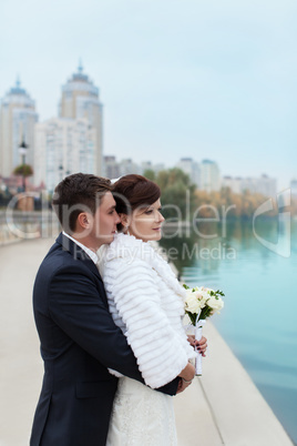 Gentle embrace bride and groom