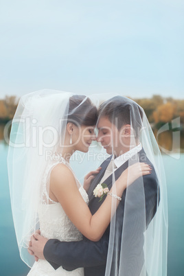 Gentle embrace bride and groom