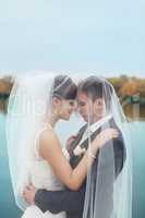 Gentle embrace bride and groom