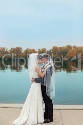 Gentle embrace bride and groom