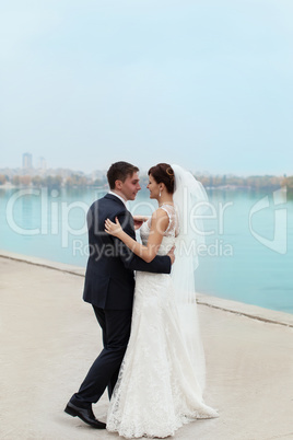 Gentle embrace bride and groom