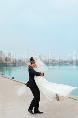 Gentle embrace bride and groom