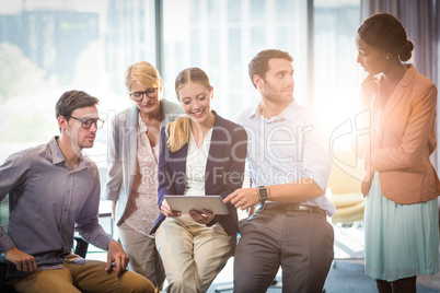 Business people interacting using digital tablet