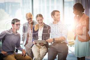 Business people interacting using digital tablet