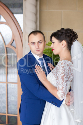 Couple standing in the rain on the wedding day