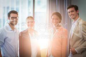 Businessmen and businesswomen posing together