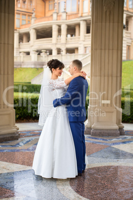 Couple standing in the rain on the wedding day