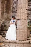 Brunette bride in white dress