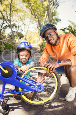 Family repairing a bike