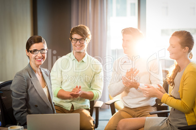 Business people clapping hands in the meeting