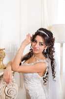 Rich Bride with beautiful eyes in the apartment