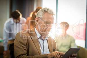 Businessman working on digital tablet