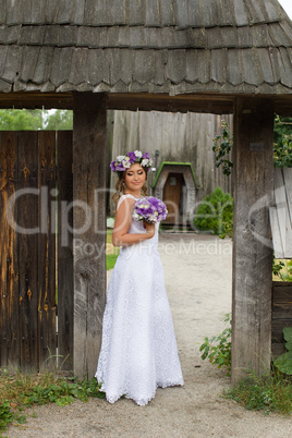 Bride with a wreath on his head, outside the city