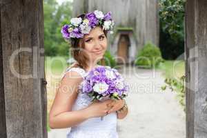 Bride with a wreath on his head, outside the city