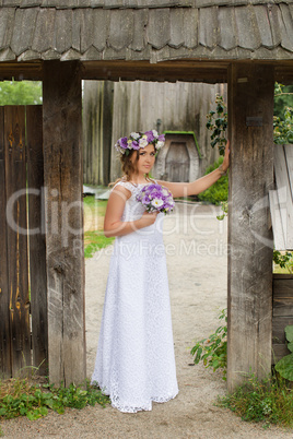 Bride with a wreath on his head, outside the city