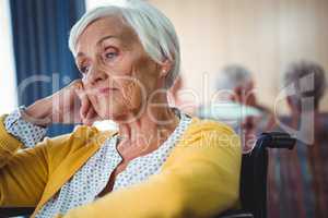 Senior woman in wheelchair look worried